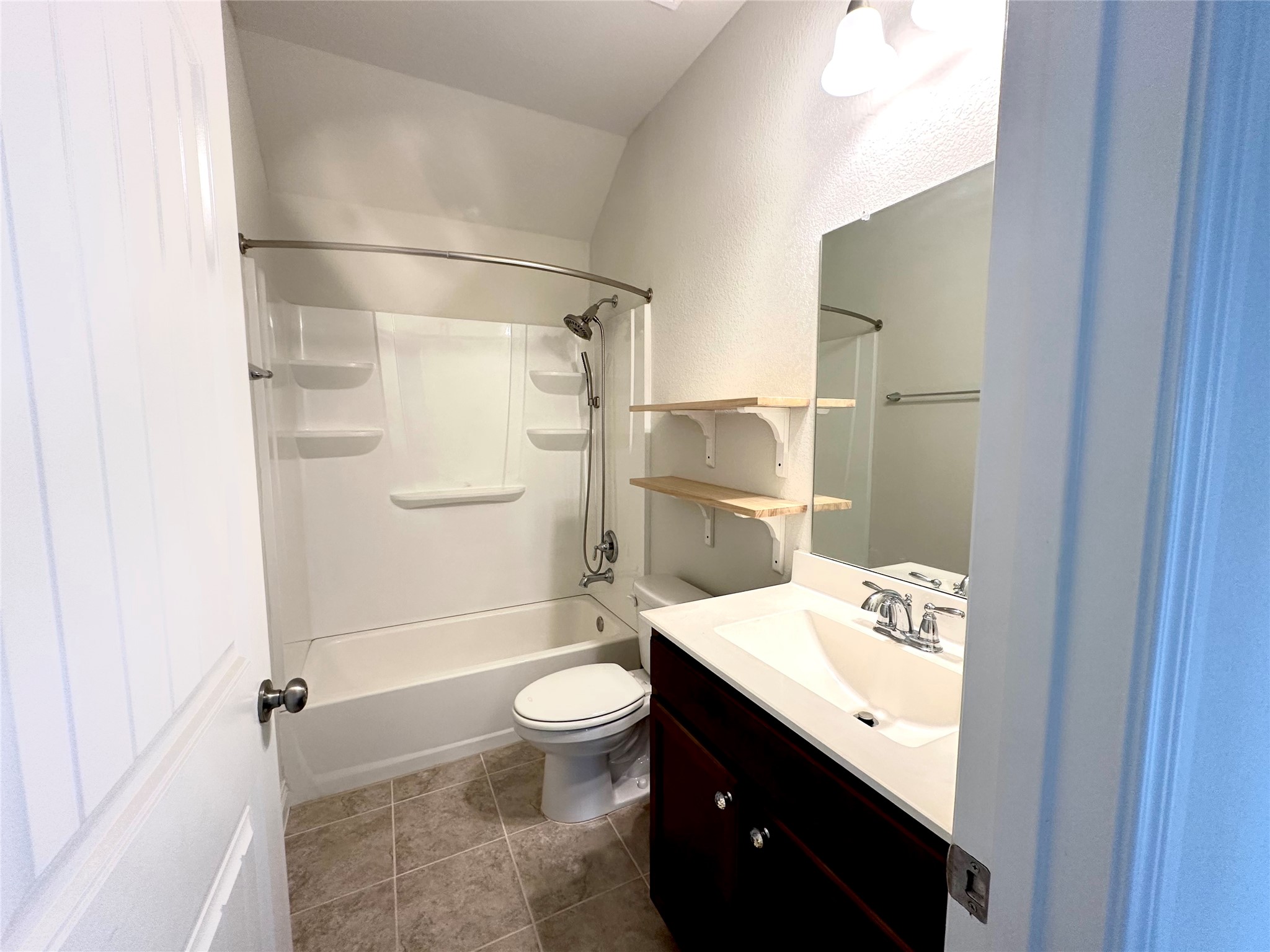 9719 Hazel Fern Court Spring, TX 77379 - Photo 20 of 21 a bathroom with a sink a toilet and shower