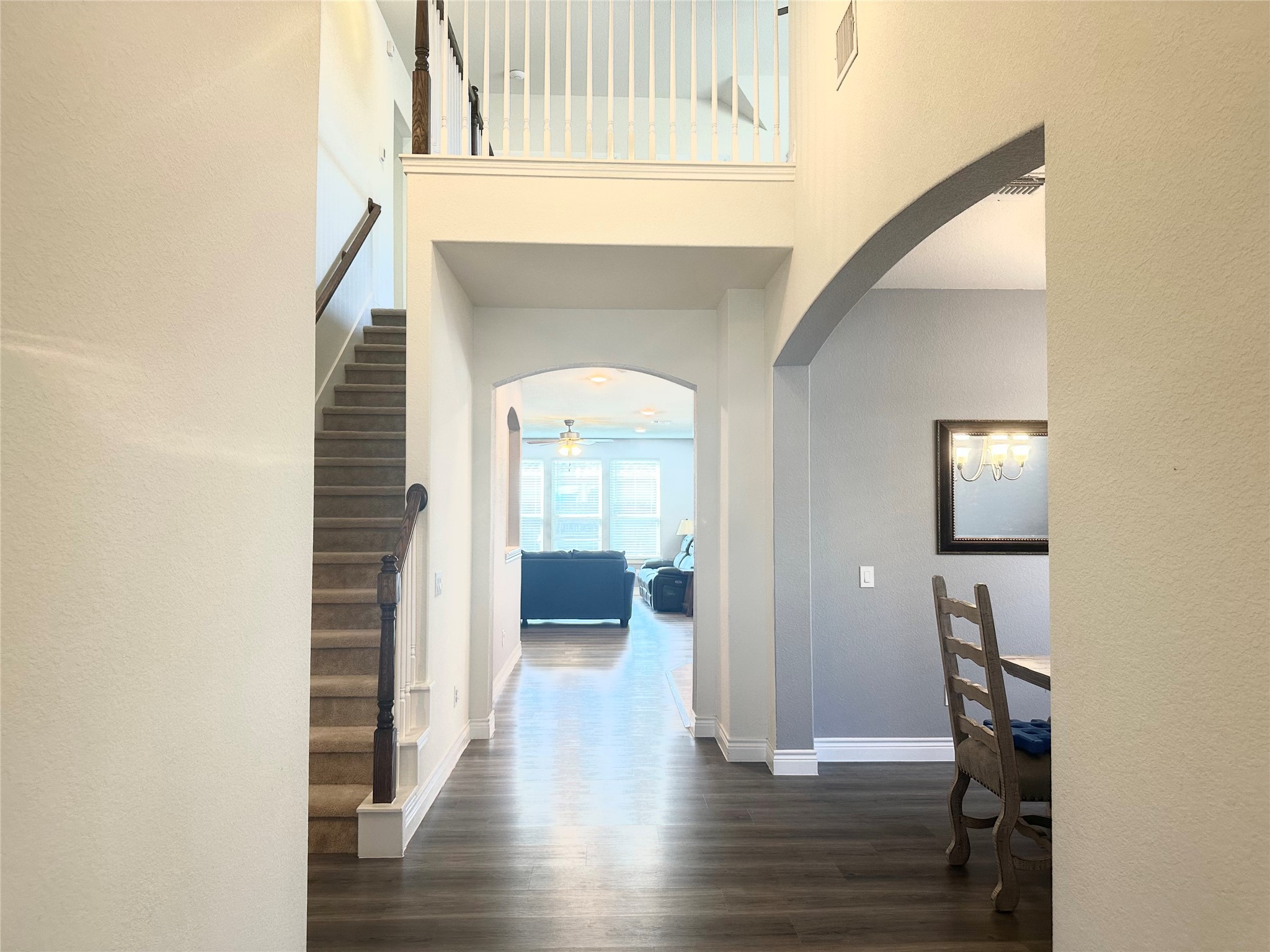 9719 Hazel Fern Court Spring, TX 77379 - Photo 3 of 21 a view of a hallway with wooden floor and staircase