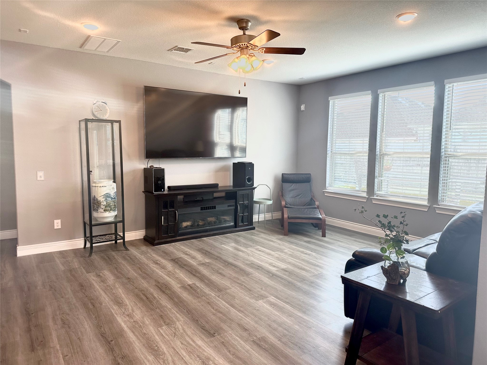 9719 Hazel Fern Court Spring, TX 77379 - Photo 5 of 21 a living room with furniture and a flat screen tv