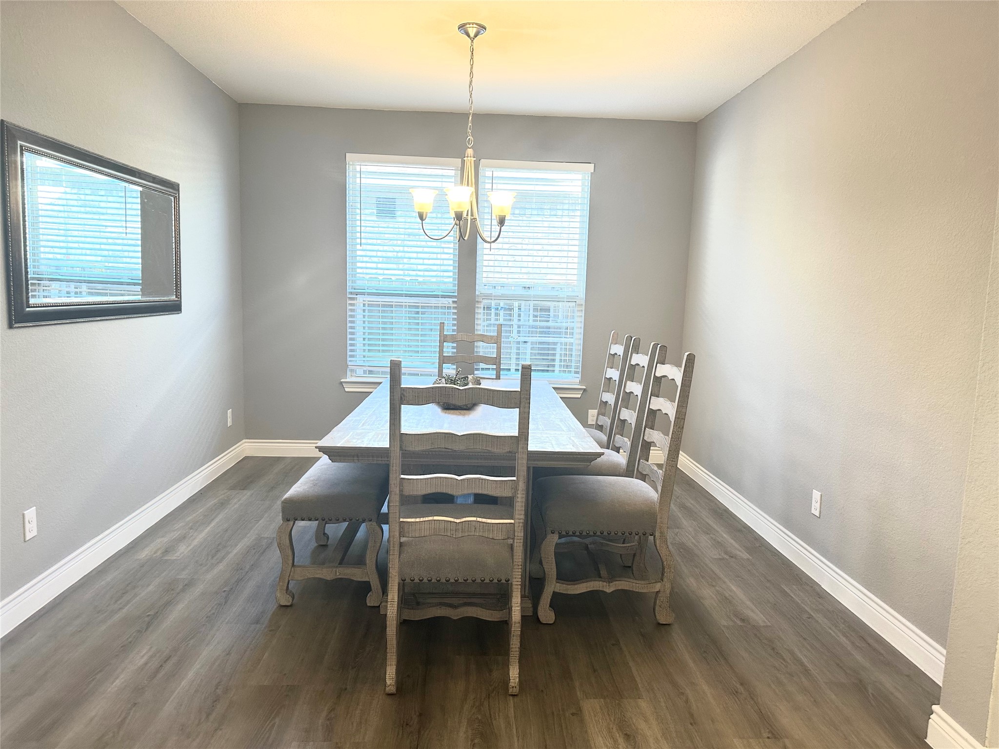 9719 Hazel Fern Court Spring, TX 77379 - Photo 6 of 21 a dining room with furniture a chandelier and wooden floor