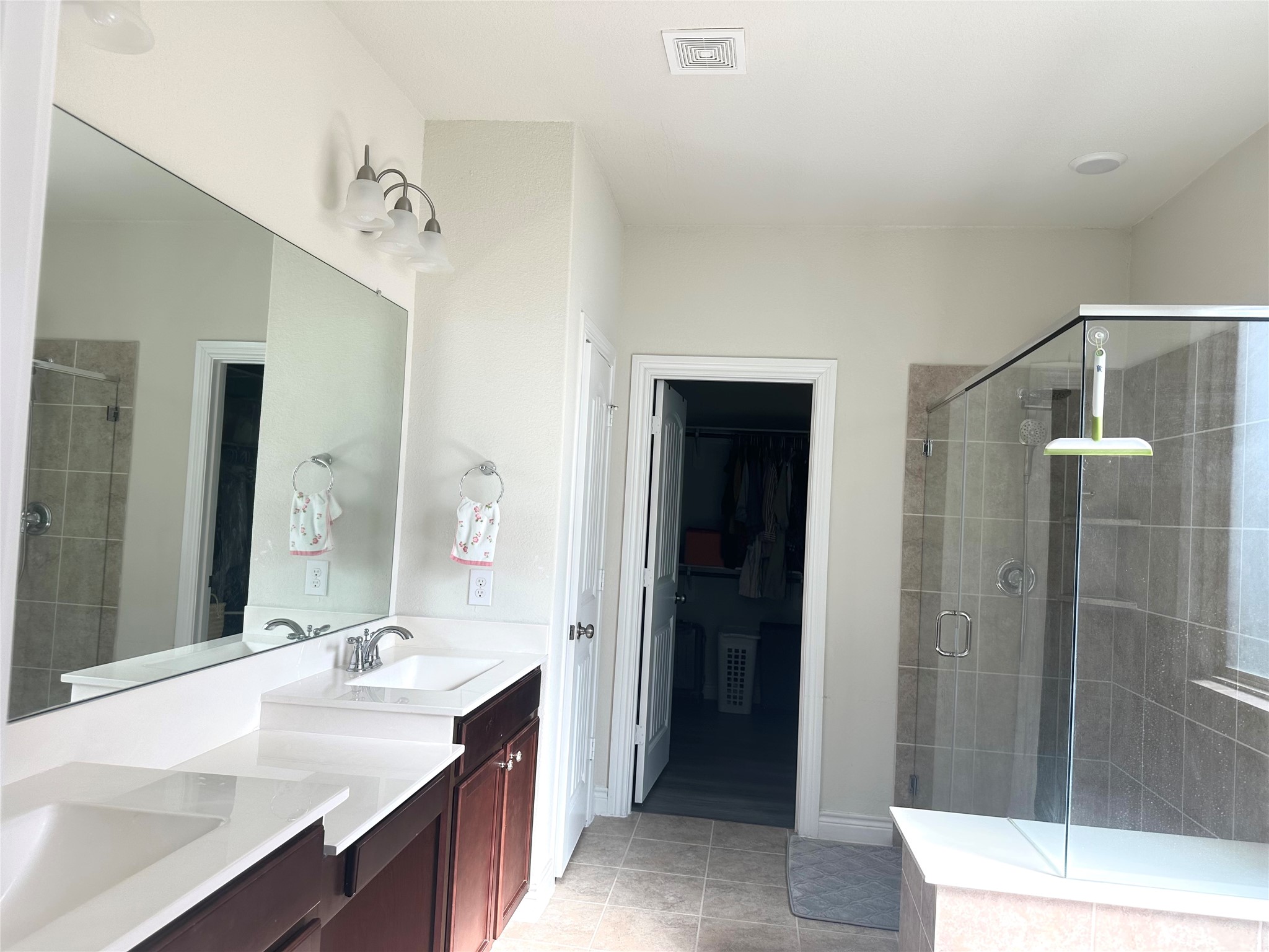 9719 Hazel Fern Court Spring, TX 77379 - Photo 9 of 21 a bathroom with a sink a shower and a mirror