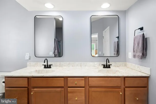 a bathroom with a glass shower door