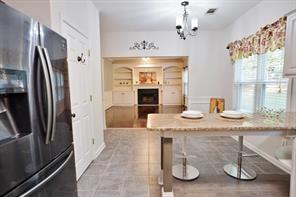 2525 Falcon Chase Court Suwanee, GA 30024 - Photo 11 of 27 a kitchen with stainless steel appliances granite countertop a sink refrigerator and microwave