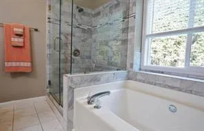 a bath tub sitting next to a window