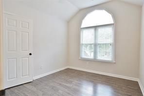 2525 Falcon Chase Court Suwanee, GA 30024 - Photo 20 of 27 an empty room with wooden floor and windows