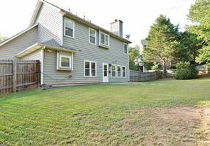 2525 Falcon Chase Court Suwanee, GA 30024 - Photo 26 of 27 a front view of a house with garden