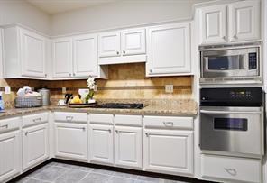 2525 Falcon Chase Court Suwanee, GA 30024 - Photo 9 of 27 a kitchen with white cabinets and sink