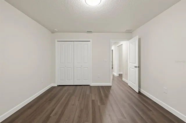 a view of wooden floor in an empty room