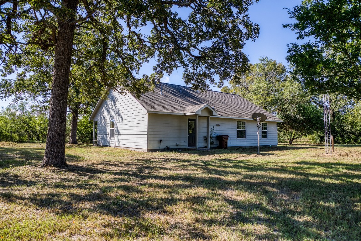 2700 Quarry Road Brenham, TX 77833 - Photo 2 of 35 a house with trees in the background
