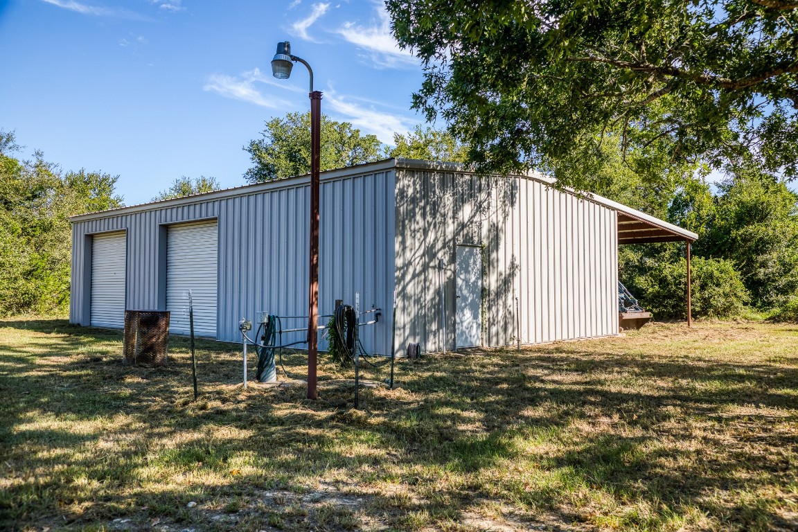 2700 Quarry Road Brenham, TX 77833 - Photo 8 of 35 a backyard of a house with table and chairs