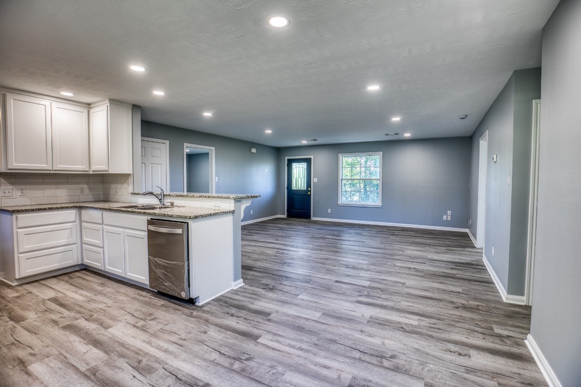 2700 Quarry Road Brenham, TX 77833 - Photo 9 of 35 a kitchen with a sink wooden floor and window