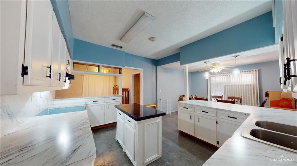 402 South Main Street Donna, TX 78537 - Photo 5 of 17 a large room with a large window and furniture