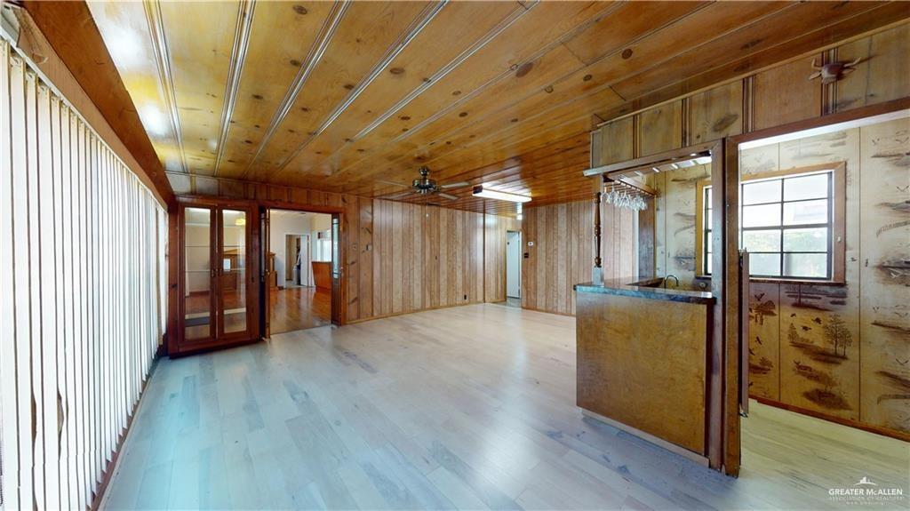 402 South Main Street Donna, TX 78537 - Photo 7 of 17 a view of an empty room with wooden floor