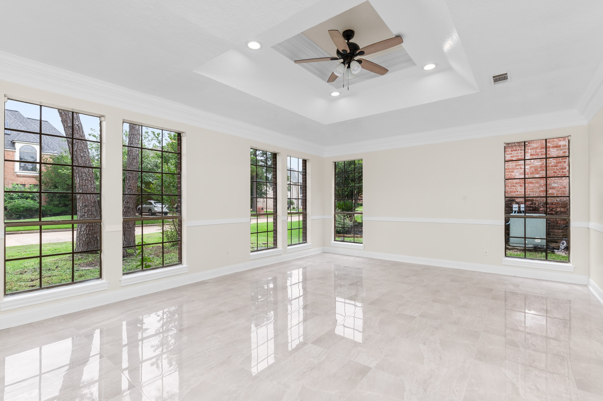17402 Wilton Park Court Spring, TX 77379 - Photo 12 of 50 a view of an empty room with a window and a kitchen area