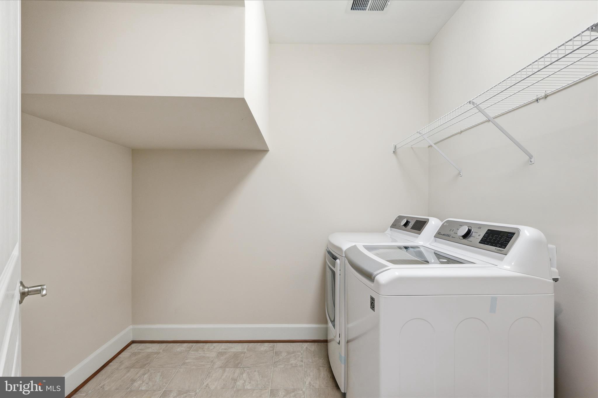 411 Spring Street Herndon, VA 20170 - Photo 10 of 46 a utility room with dryer and washer