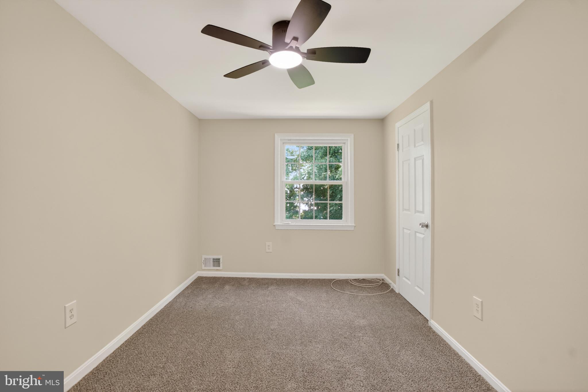 1232 Palmer Road, Unit 111 Fort Washington, MD 20744 - Photo 24 of 45 an empty room with a window and a fan