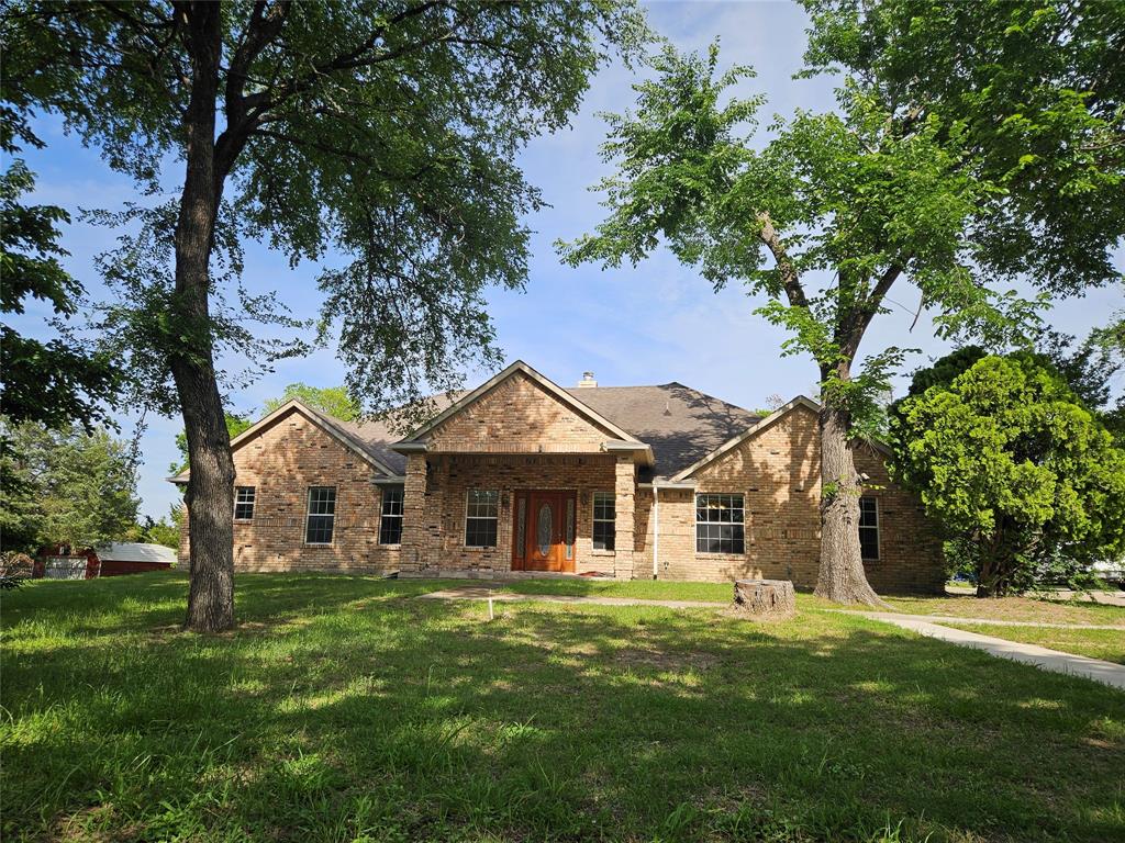 234 East Fork Road Sunnyvale, TX 75182 - Photo 15 of 32 a front view of a house with a garden