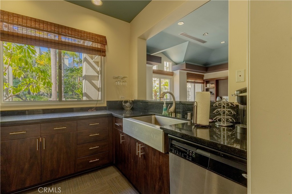 2233 Martin, Unit 108 Irvine, CA 92612 - Photo 18 of 31 a kitchen with a sink and large windows