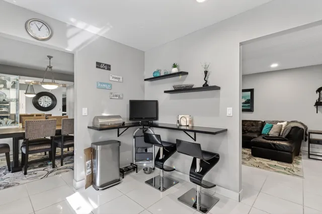 a view of a dining room with furniture window and a chandelier