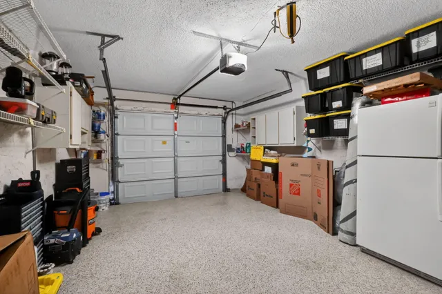 an aerial view of a house with garden space and street view