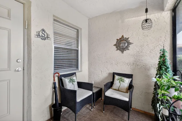 a aerial view of a chairs and table in a backyard