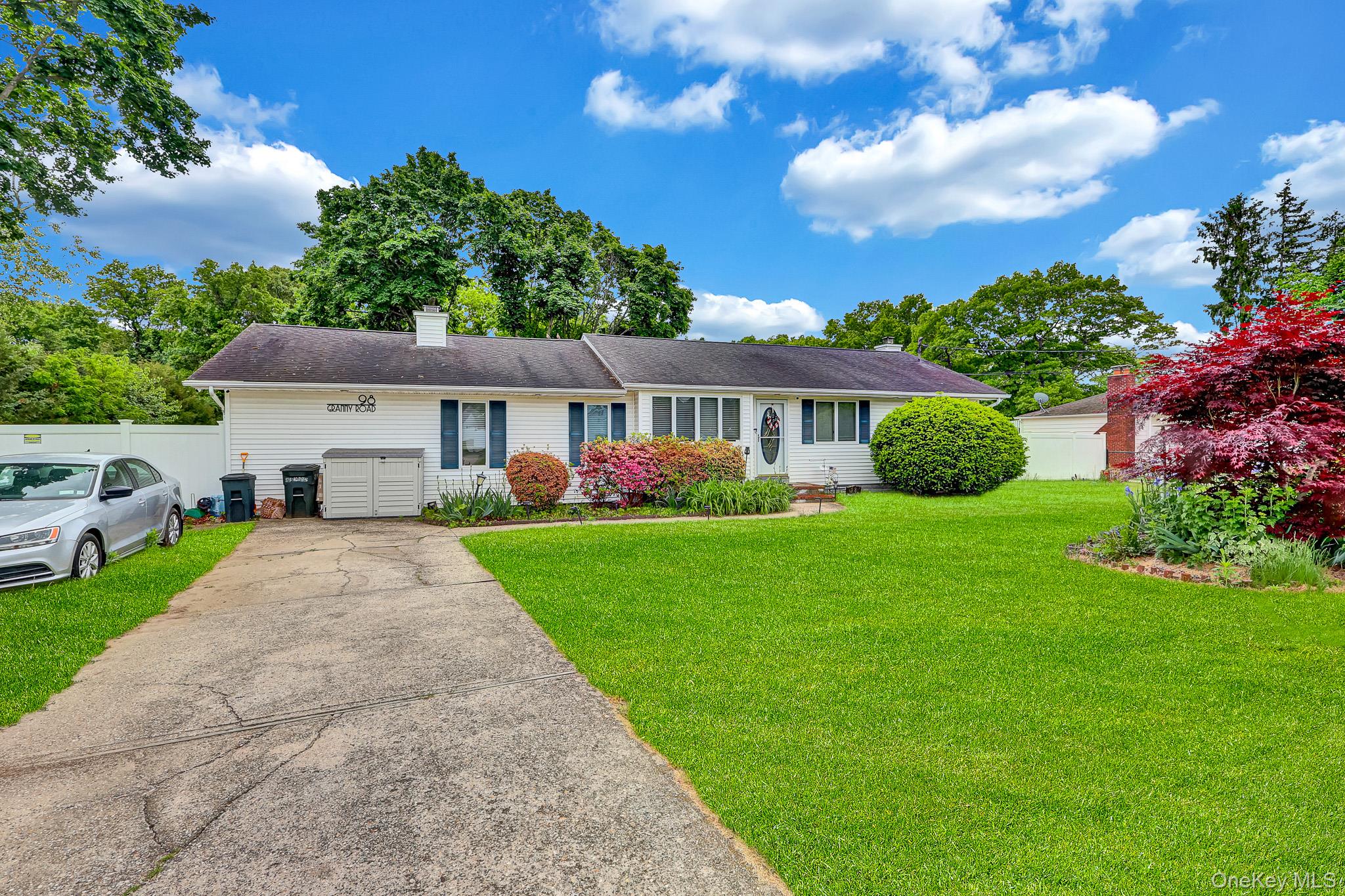 98 Granny Road Farmingville, NY 11738 - Photo 3 of 24 a front view of house with yard and green space