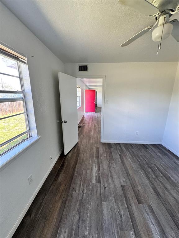 1808 Spring Lake West Brownwood, TX 76801 - Photo 4 of 12 a view of hallway with window and wooden floor