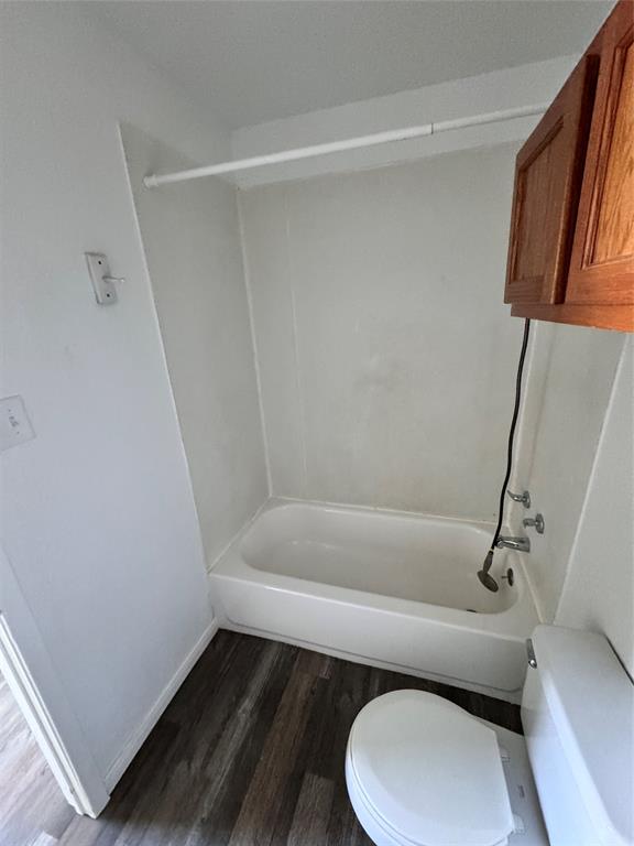 1808 Spring Lake West Brownwood, TX 76801 - Photo 5 of 12 a bathroom with a toilet and a bathtub