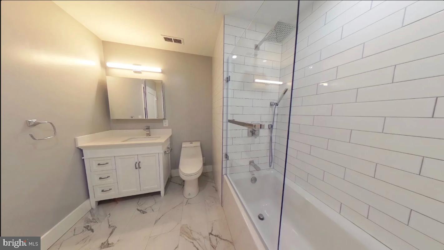 150 South Independence Mall West, Unit 802 Philadelphia, PA 19106 - Photo 3 of 8 a bathroom with a sink a toilet and shower