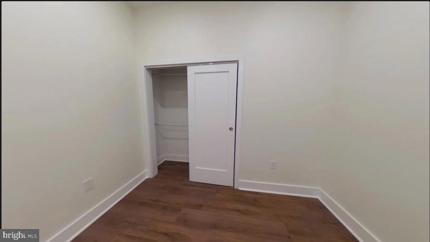 150 South Independence Mall West, Unit 802 Philadelphia, PA 19106 - Photo 7 of 8 a view of an empty room with wooden floor