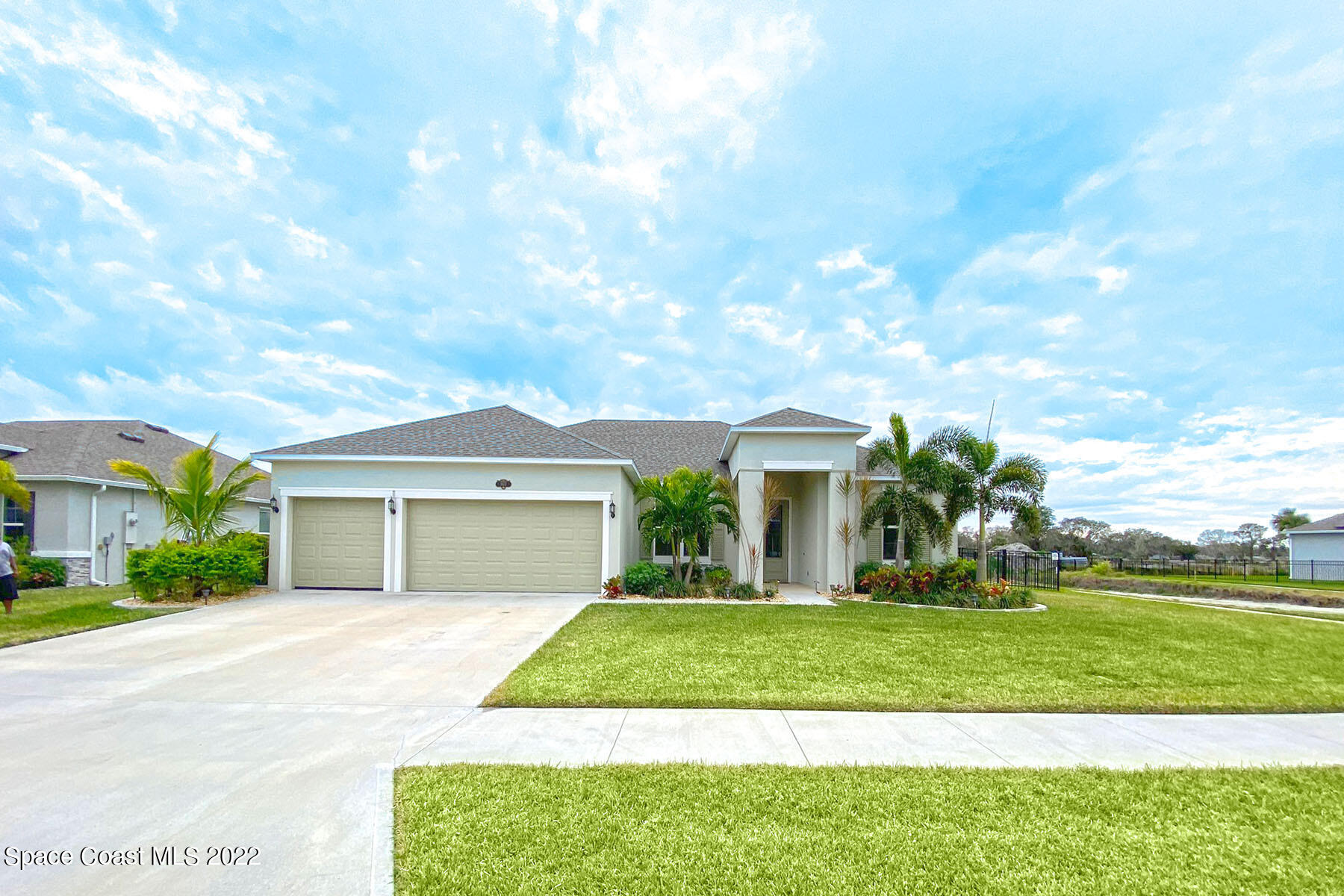 1923 Killian Drive Palm Bay, FL 32905 - Photo 1 of 44 a front view of a house with a yard