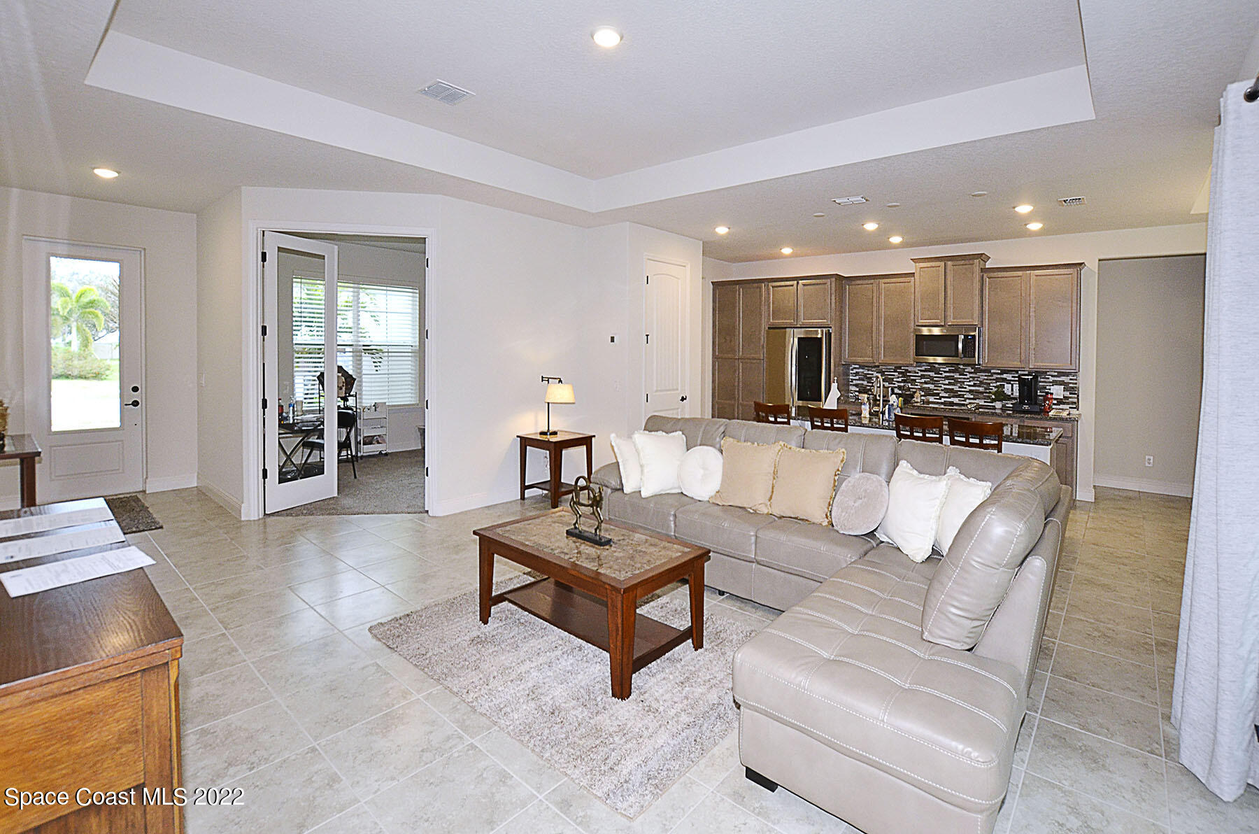 1923 Killian Drive Palm Bay, FL 32905 - Photo 13 of 44 a living room with furniture and wooden floor