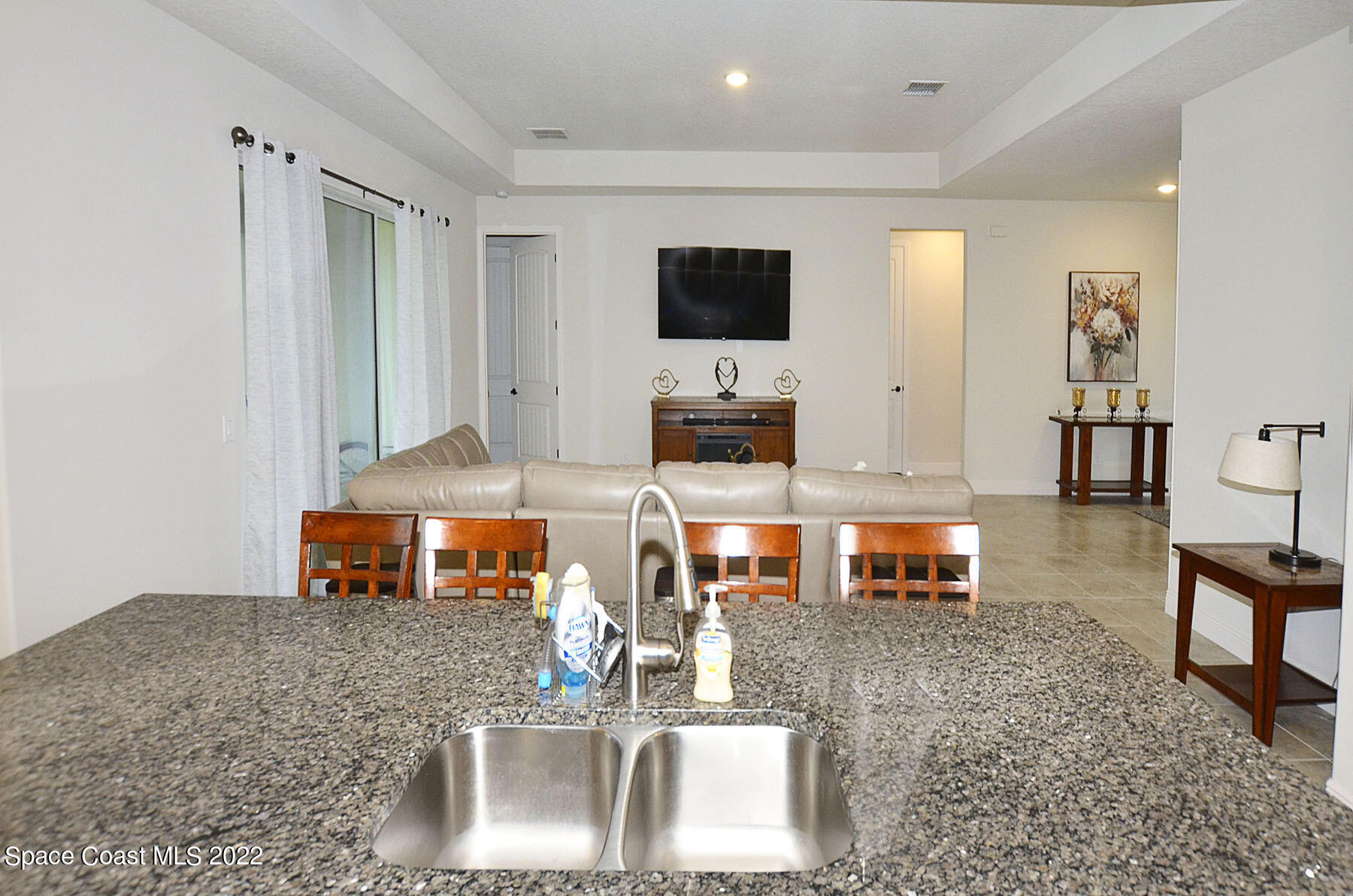 1923 Killian Drive Palm Bay, FL 32905 - Photo 16 of 44 a living room with furniture and a flat screen tv