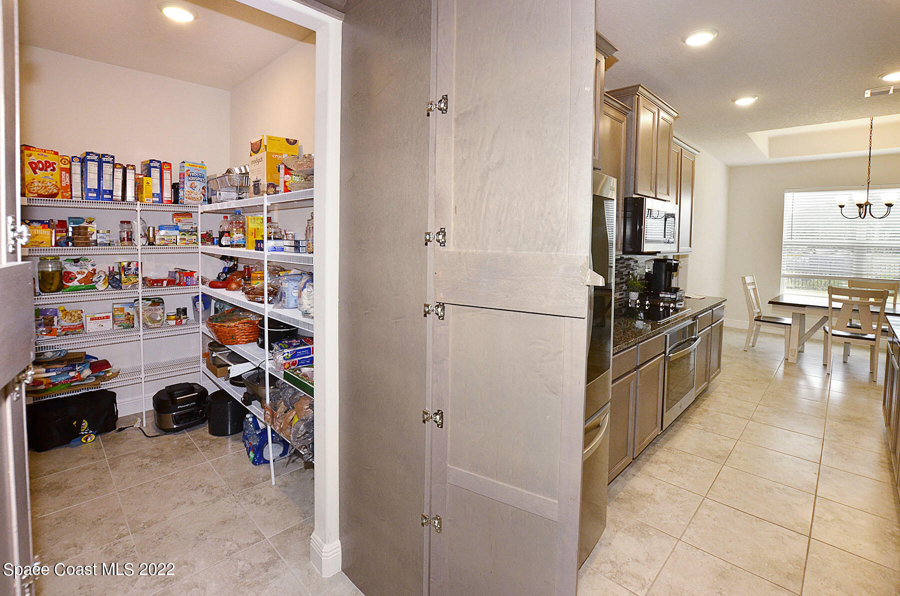 1923 Killian Drive Palm Bay, FL 32905 - Photo 21 of 44 a kitchen with stainless steel appliances a refrigerator and a sink