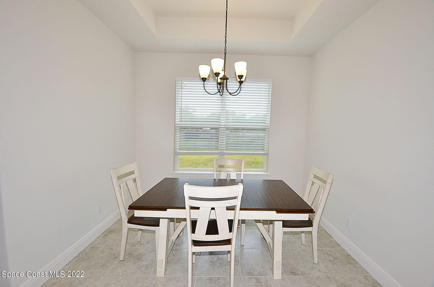 1923 Killian Drive Palm Bay, FL 32905 - Photo 22 of 44 a view of a dining room with furniture and chandelier