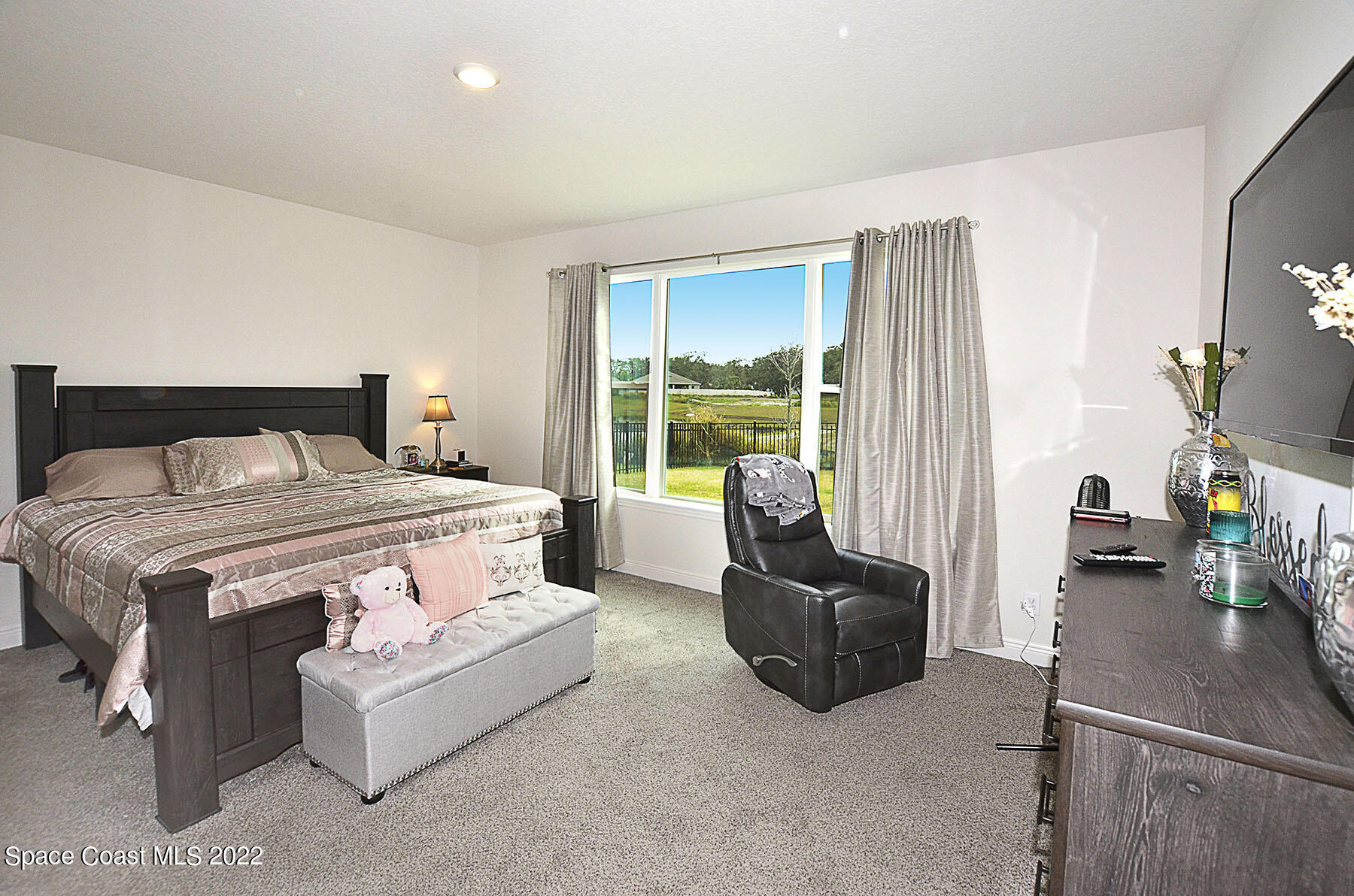 1923 Killian Drive Palm Bay, FL 32905 - Photo 23 of 44 a bedroom with a bed and couch