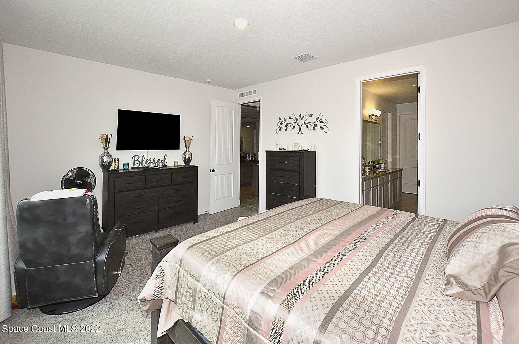 1923 Killian Drive Palm Bay, FL 32905 - Photo 24 of 44 a bedroom with a bed and a television
