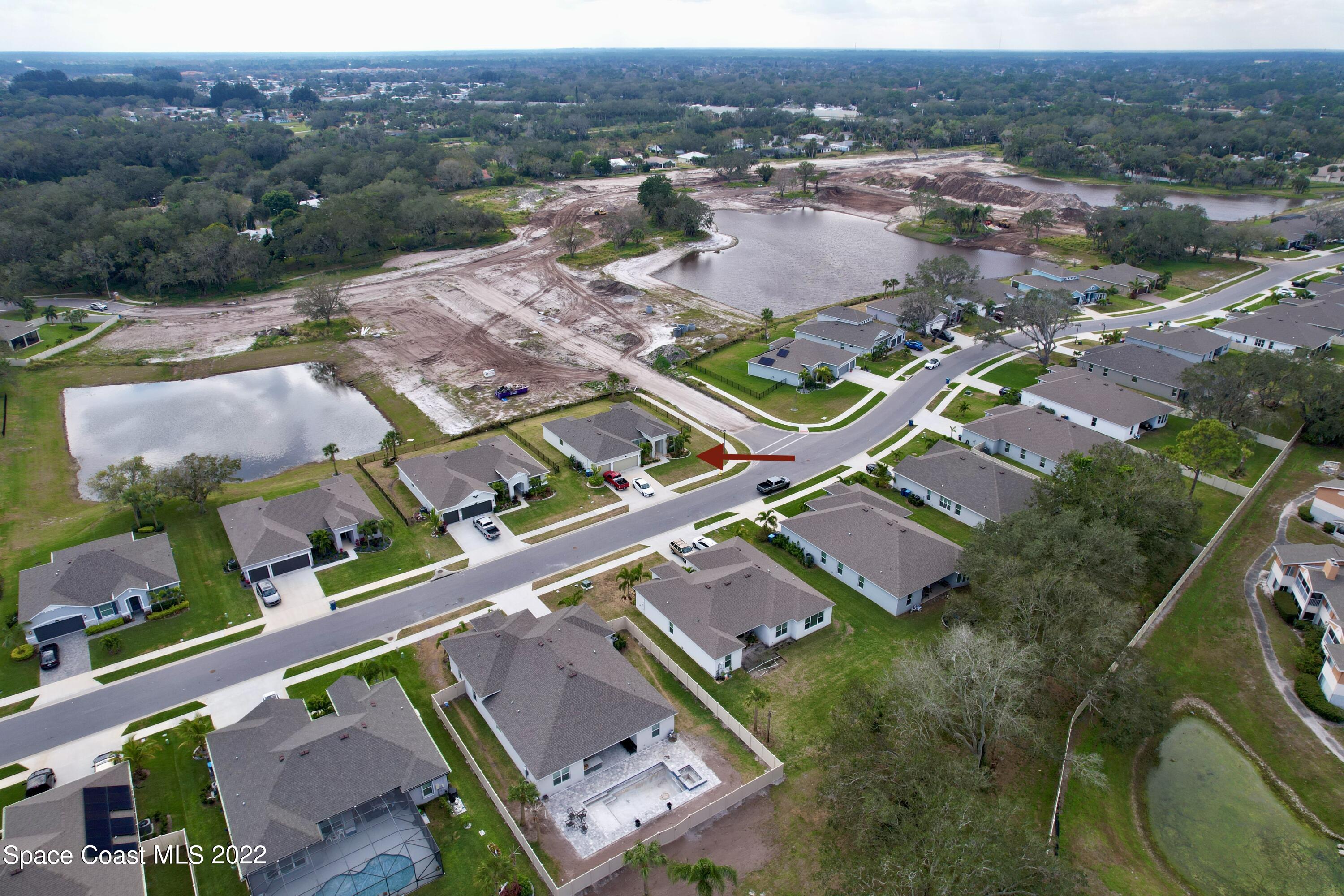 1923 Killian Drive Palm Bay, FL 32905 - Photo 3 of 44 an aerial view of multiple houses with yard