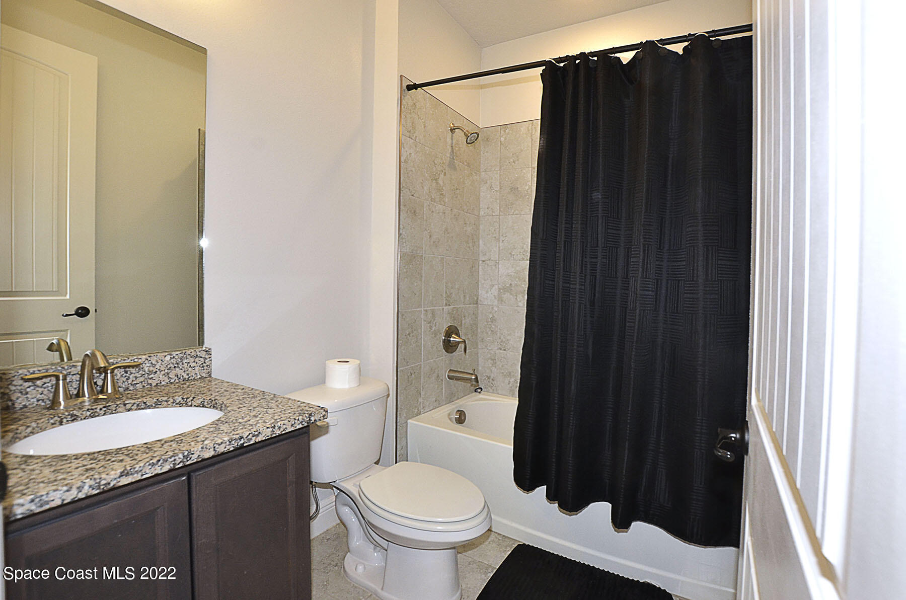 1923 Killian Drive Palm Bay, FL 32905 - Photo 34 of 44 a bathroom with a granite countertop sink toilet and shower