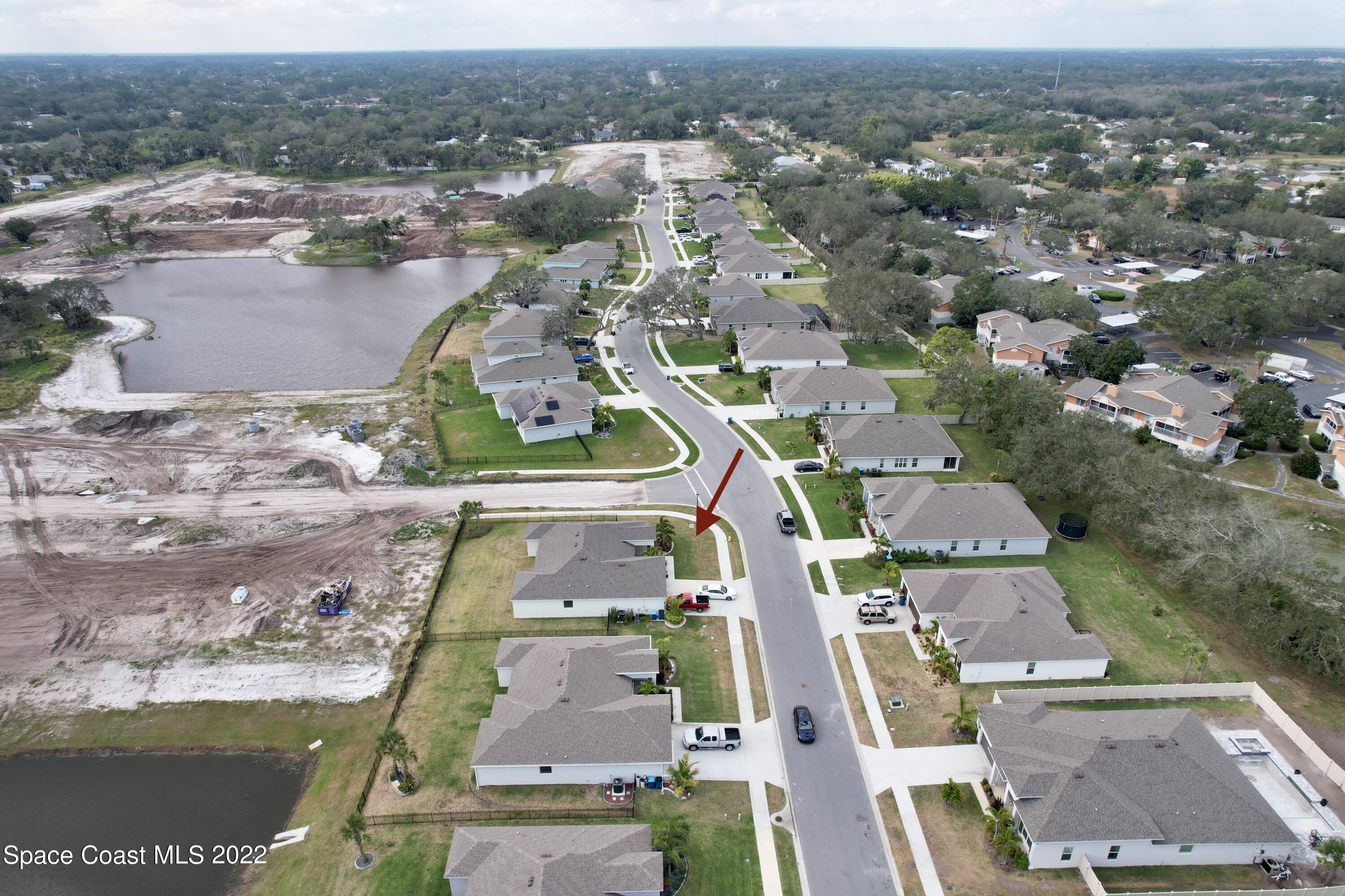 1923 Killian Drive Palm Bay, FL 32905 - Photo 4 of 44 an aerial view of residential houses with outdoor space