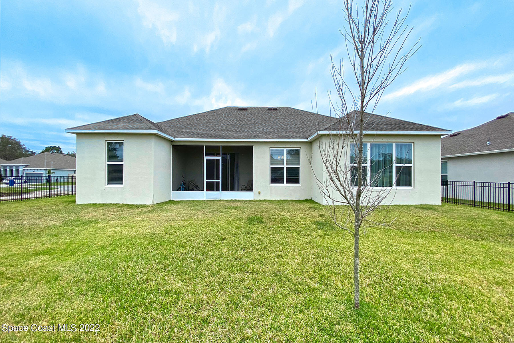 1923 Killian Drive Palm Bay, FL 32905 - Photo 41 of 44 a front view of a house with a garden