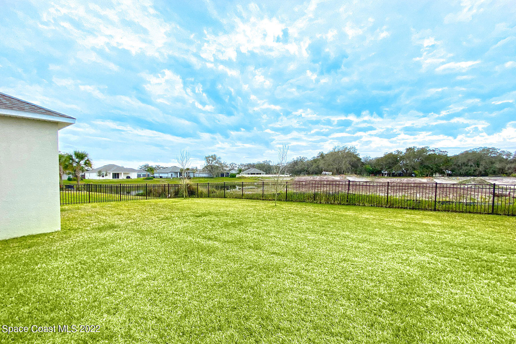 1923 Killian Drive Palm Bay, FL 32905 - Photo 42 of 44 a view of a golf course with a lake
