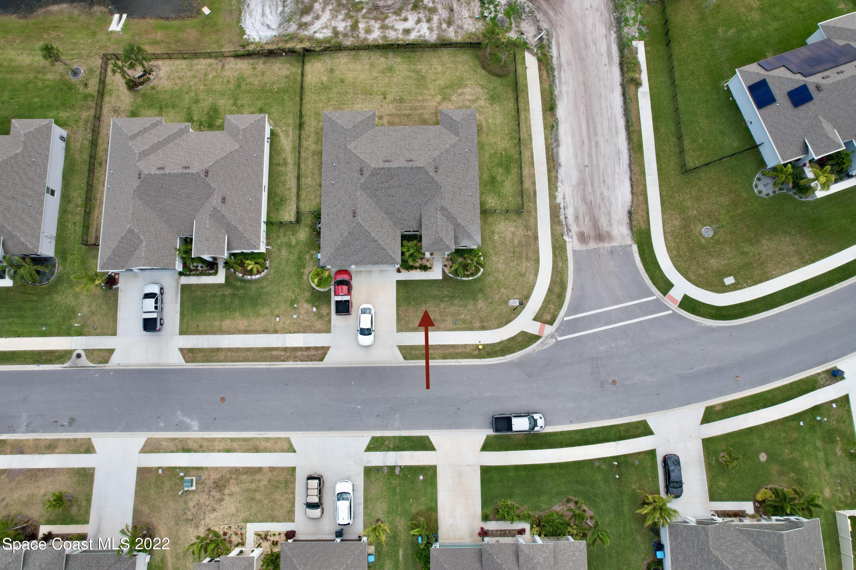 1923 Killian Drive Palm Bay, FL 32905 - Photo 5 of 44 front view of a brick building with a swimming pool