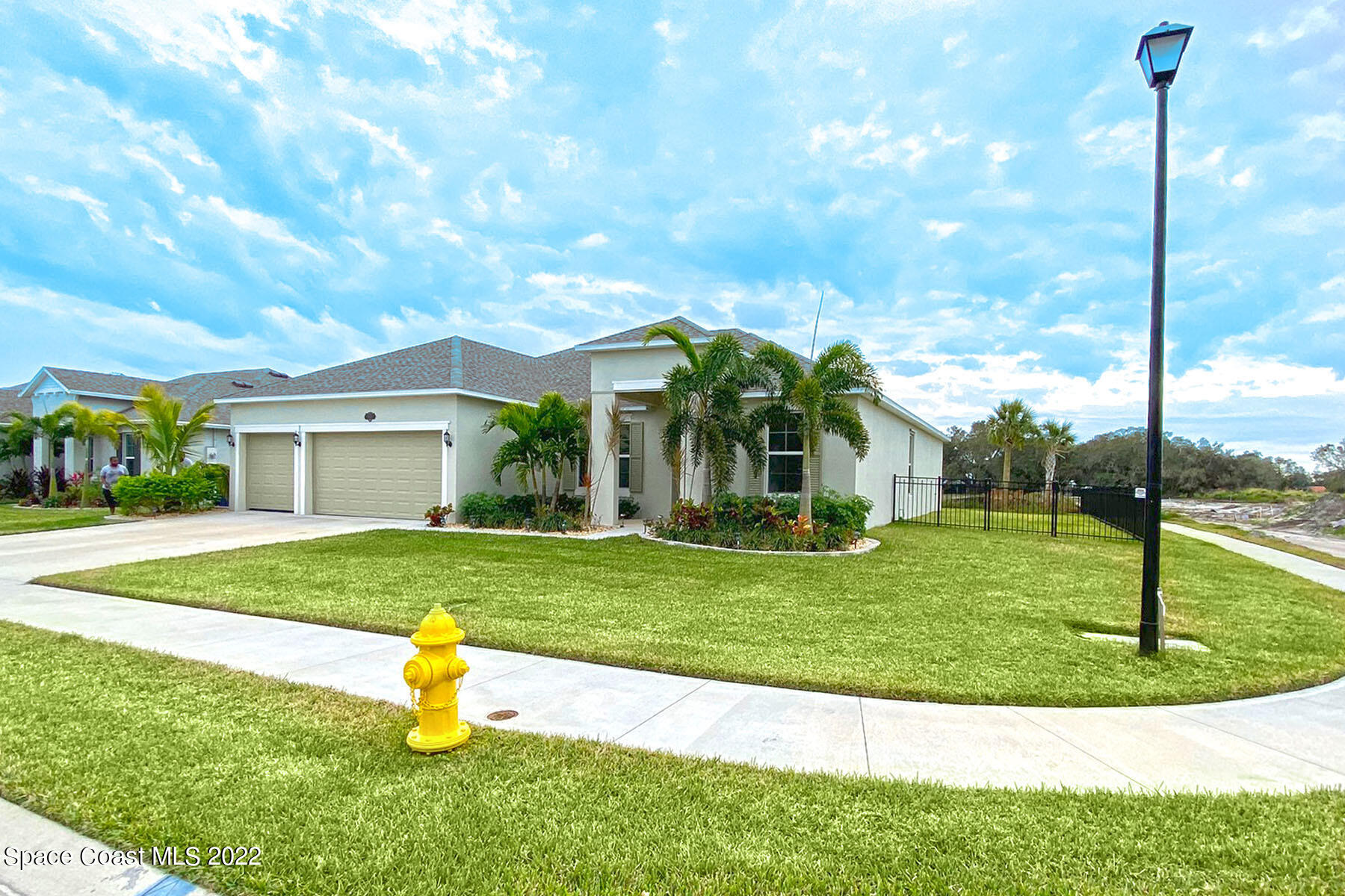 1923 Killian Drive Palm Bay, FL 32905 - Photo 7 of 44 a front view of a house with a yard