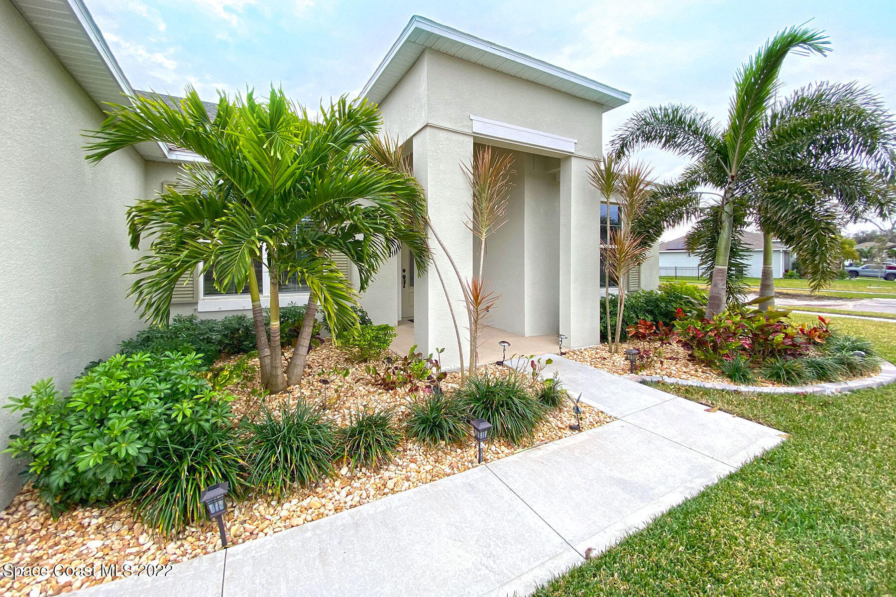 1923 Killian Drive Palm Bay, FL 32905 - Photo 8 of 44 a front view of a house with a yard