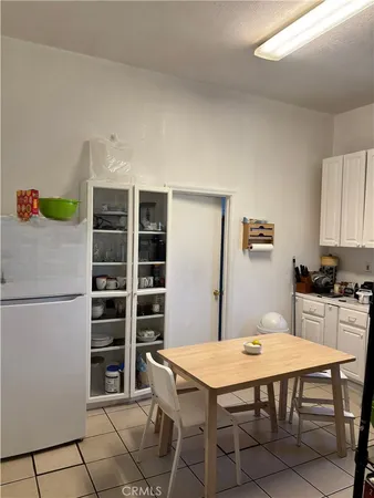 a dining room with a table and chairs