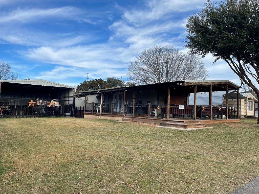 2334 San Bar Road, Unit 71 Graford, TX 76449 - Photo 28 of 40 L shaped porch with a new TV and great views