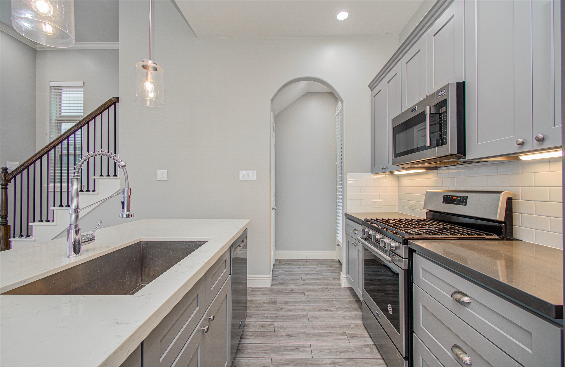 8903 Spring Knoll Forest Drive Houston, TX 77080 - Photo 6 of 29 a kitchen that has a sink and a stove