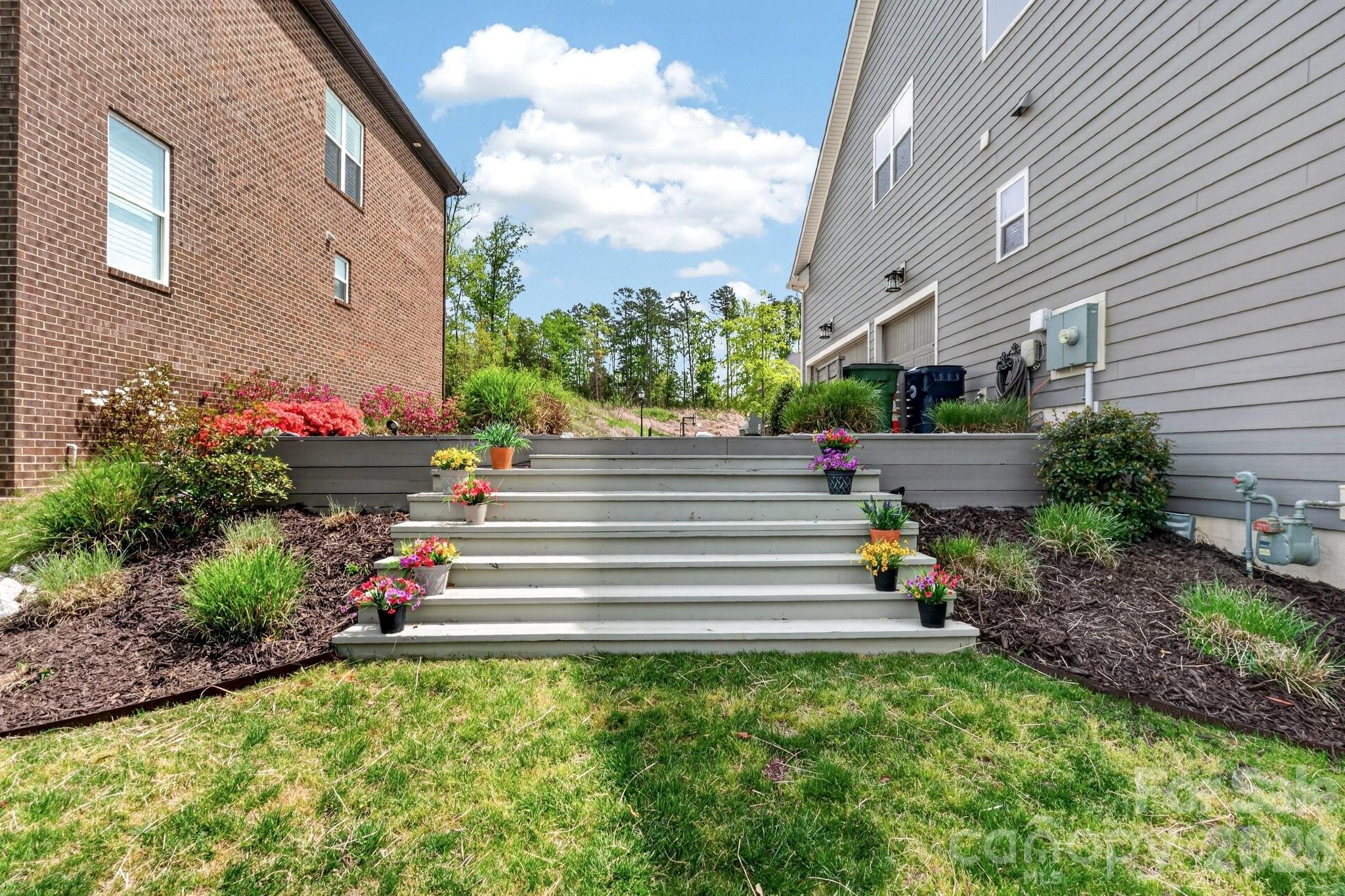 18421 Doves Crest Road Cornelius, NC 28031 - Photo 43 of 48 a view of garden with lots of potted plants