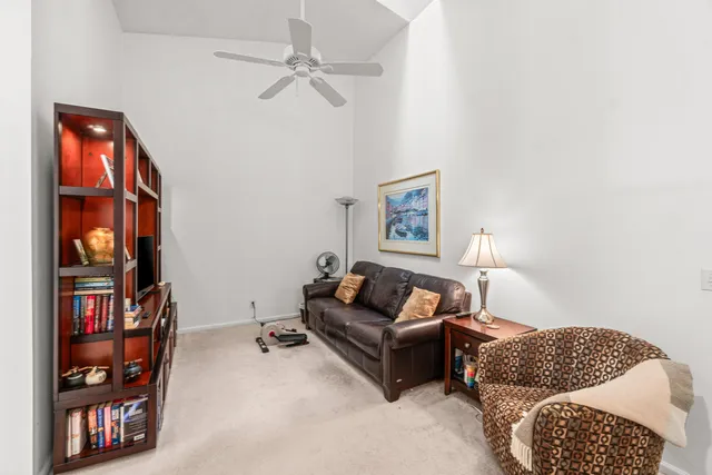 a kitchen with stainless steel appliances kitchen island granite countertop a sink and cabinets